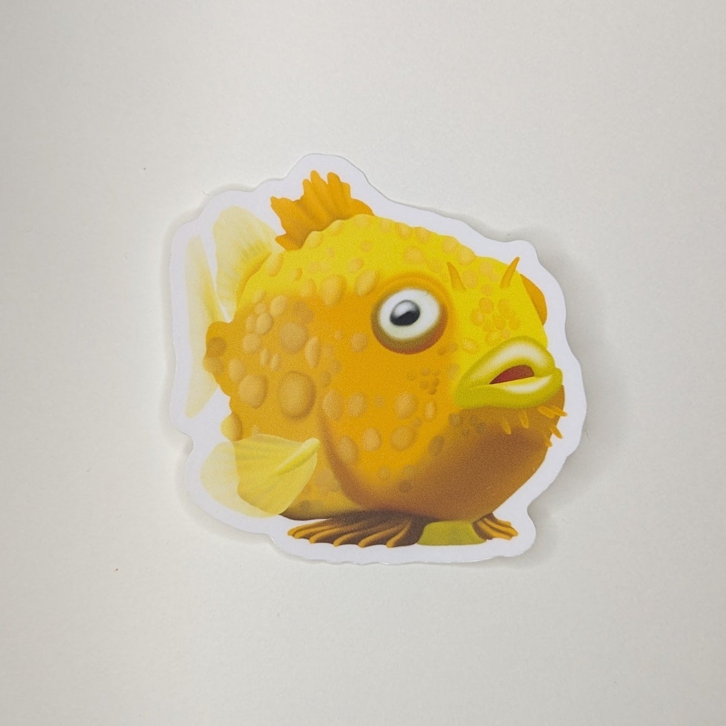 Pacific Spiny Lumpsucker sticker. A round lumpy orange fish.