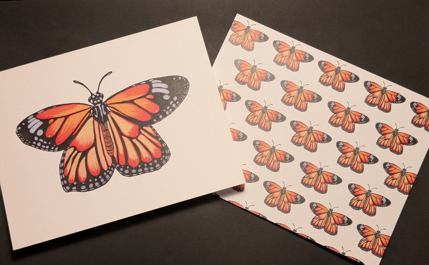 Two cards on a black background. One has a single monarch butterfly on the front. The second one has monarch butterflies in a repeating pattern on the front.