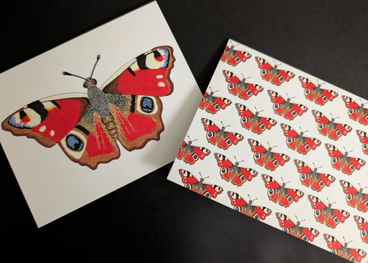 Two 4x6 cards on a black background. One card has a solo peacock butterfly on the front. The second card has a repeating pattern of peacock butterflies across the front.