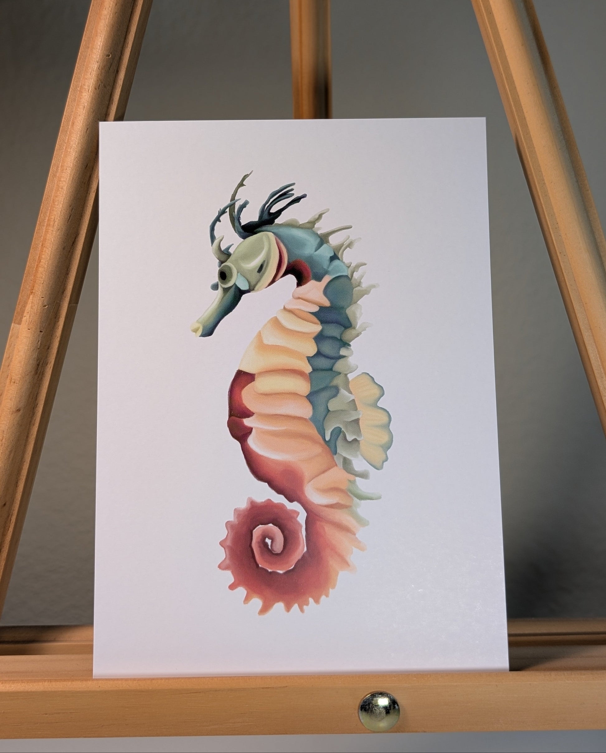 Print of a yellow, green, and maroon seahorse with spines